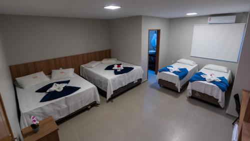 Postel nebo postele na pokoji v ubytování Hotel Marajó - Turismo de Experiência