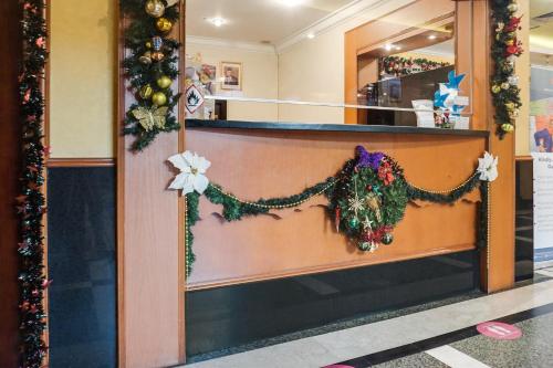 a store front with christmas decorations on the counter at Townhouse OAK Bi Executive in Jakarta