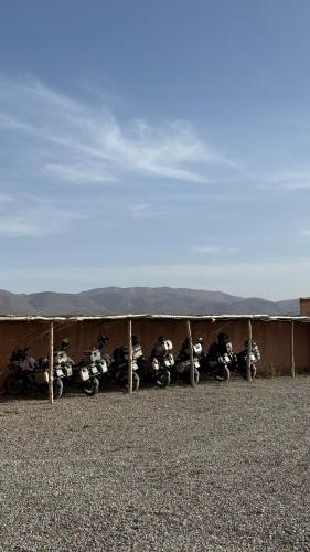 a row of motorcycles parked next to a building at DAR AL QANASS IMANE in Midelt