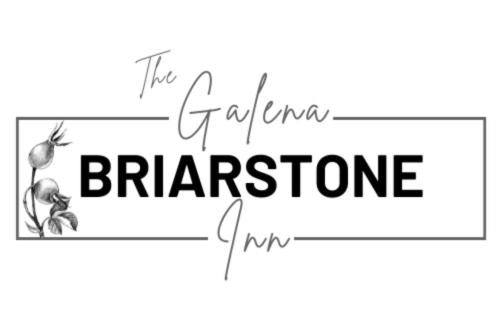 a black and white sign with the text the enchanted brinealore at Briarstone Inn Unit 2 in Galena