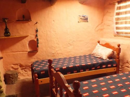 Cama o camas de una habitación en Casa Minerva, construcción de materiales autoctonos
