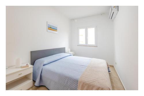 Ένα ή περισσότερα κρεβάτια σε δωμάτιο στο Battigia SOLEMAR-Alcamo Marina
