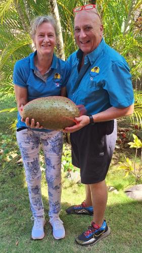 a man and a woman holding a large bread at Boca Chica Bay Eco Lodge in Boca Chica