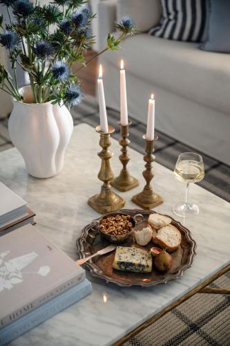 a table with candles and a plate of food and wine at Lawsons Estate on Macquarie Farm in Brewongle
