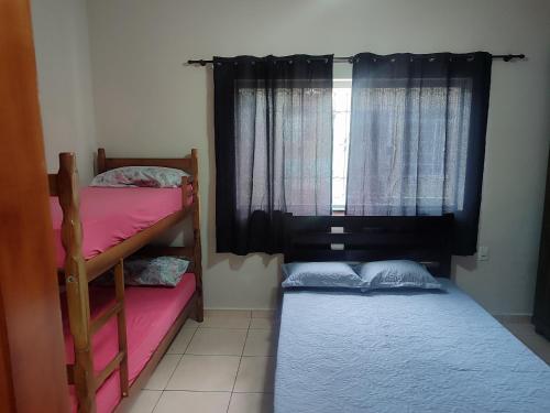 Letto o letti in una camera di Casa em Aparecida próx a Basílica de Nossa Senhora