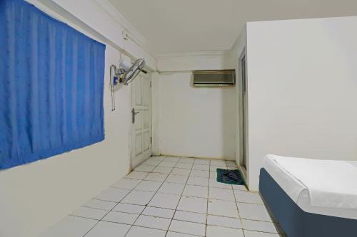 Postel nebo postele na pokoji v ubytování Hotel O Wisma Permata Syariah