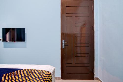Postel nebo postele na pokoji v ubytování Hotel O Pondok Mulia Syariah