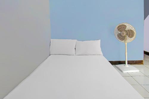 Katil atau katil-katil dalam bilik di Hotel O Sukandi Homestay Near The Semeton Homestay