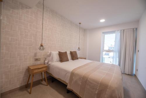 Letto o letti in una camera di NUBA apartamentos turísticos