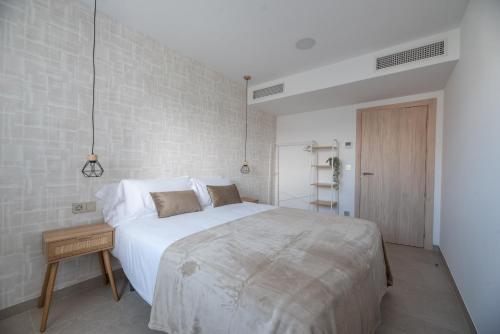 Letto o letti in una camera di NUBA apartamentos turísticos