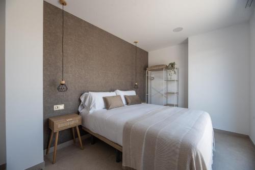 Letto o letti in una camera di NUBA apartamentos turísticos
