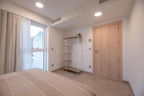 Letto o letti in una camera di NUBA apartamentos turísticos