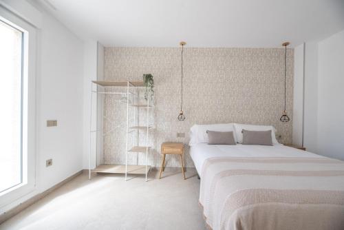 Letto o letti in una camera di NUBA apartamentos turísticos