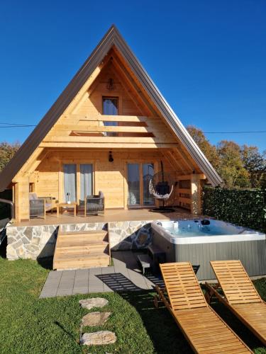 a house with a pool in the yard at Planinska kuća za odmor Aneva in Sveti Rok