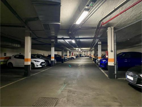a parking garage with cars parked in it at Lujoso Loft La Moraleja in Madrid