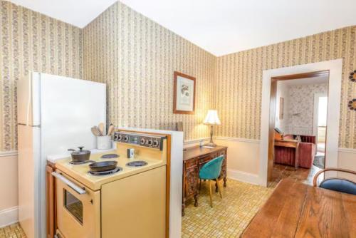 a kitchen with a stove and a refrigerator at Briarstone Inn Unit 3 in Galena