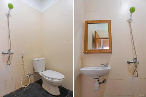 une salle de bain avec toilettes, lavabo et miroir dans l'établissement SPOT ON 92569 Anto Homestay SyariahNearPelabuhan Feri Harbor Bay, à Nagoya