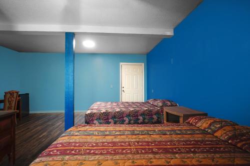 Postel nebo postele na pokoji v ubytování Plaza Motel Corpus Christi by OYO