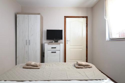 Cama o camas de una habitación en Apartments Moskov