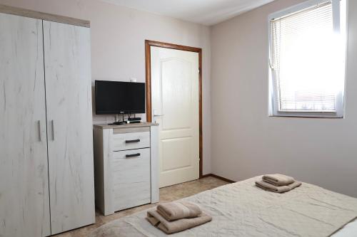 Cama o camas de una habitación en Apartments Moskov