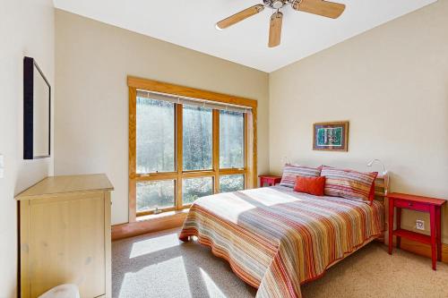a bedroom with a bed and a window at 5 Bed 4 Bath Vacation home in Tuckasegee in Tuckasegee