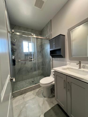 a bathroom with a shower and a toilet and a sink at Vacation home in Westminster