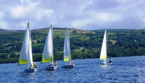 four small sailboats in a large body of water at Killaloe Hotel & Spa in Killaloe