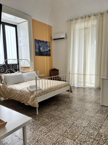 Letto o letti in una camera di Il Teatro Rooms