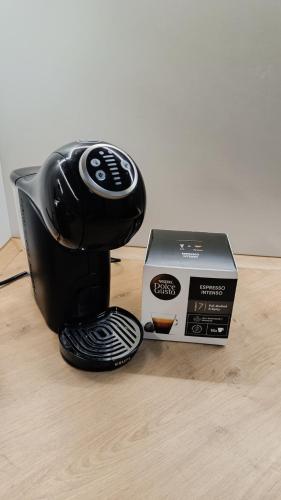 a coffee maker and a box on a table at Apartment Skopje in Skopje