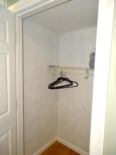 a closet with a hanger on the wall at Beautiful 2 Bed Apt Minutes from Encore in Everett