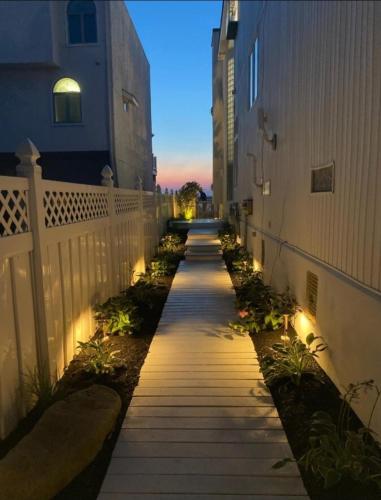 a walkway with lights on the side of a building at Miami Vice Ocean City- 5BR | Private Pool | Views in Ocean City