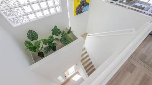 an overhead view of a staircase with plants at Miami Vice Ocean City- 5BR | Private Pool | Views in Ocean City