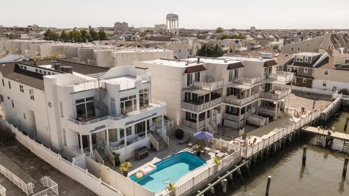 an aerial view of a large white house with a pool at Miami Vice Ocean City- 5BR | Private Pool | Views in Ocean City
