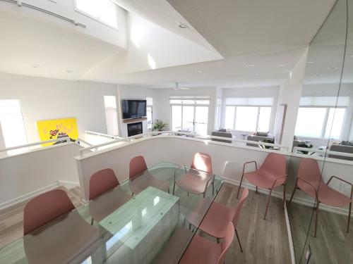 a conference room with a glass table and chairs at Miami Vice Ocean City- 5BR | Private Pool | Views in Ocean City