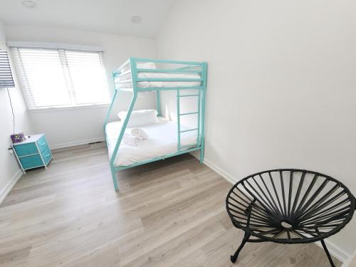 a room with a bunk bed and a chair at Miami Vice Ocean City- 5BR | Private Pool | Views in Ocean City