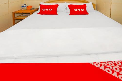 Katil atau katil-katil dalam bilik di Hotel O Melati