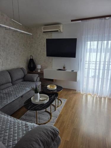 a living room with a couch and a table at VILA MARIJA in Mimice