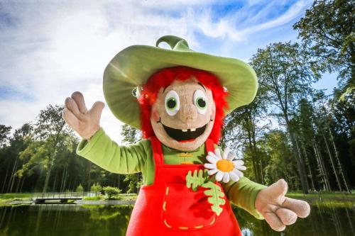 a mascot dressed in a mexican outfit holding a flower at Best Western Premier Park Hotel & Spa in Bad Lippspringe