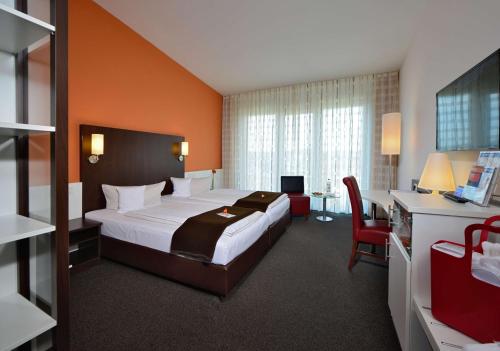 Postel nebo postele na pokoji v ubytování Best Western Plus Konrad Zuse Hotel