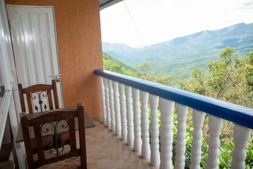 a balcony with a view of the mountains at HCR Hotel y Centro de Convenciones Chinauta Real in Fusagasuga