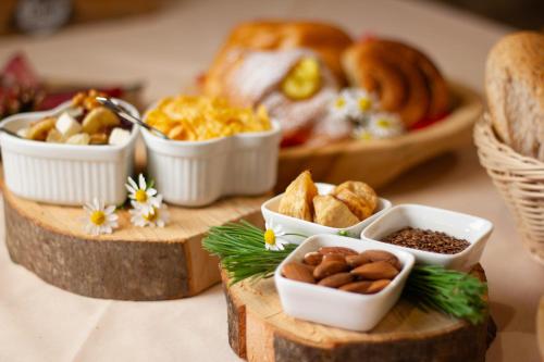 a table topped with plates of food and a plate of bread at Ongar Relax b&b in Bosco Chiesanuova