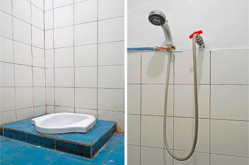 a bathroom with a shower and a toilet at OYO Life 92694 Kost Nino in Bandung