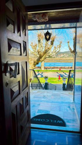an open door to a patio with a view at House Mariona in Caminha