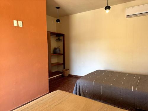 a bedroom with a bed in a room at Pineapple Mansion in Paso Hondo