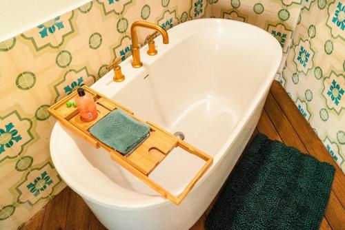 a bathroom with a bath tub with a toy at Bougainvillea 7315 Luxury Penthouse- Reserva Conchal in Playa Conchal