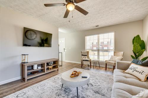 a living room with a couch and a ceiling fan at 10 Mi to Six Flags Austell Home with Expansive Yard in Austell