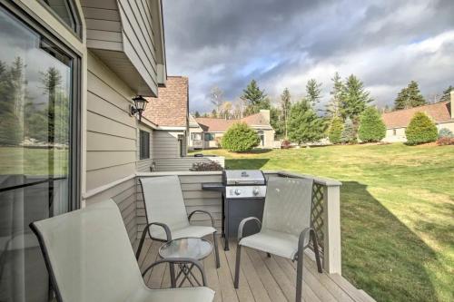 a porch with chairs and a grill on a house at FV22 Great Location close to Bretton Woods Ski Area in Carroll
