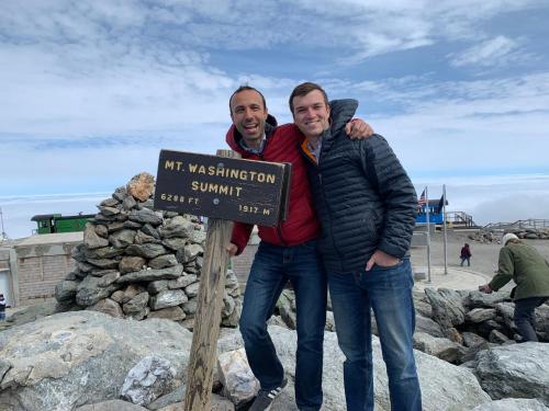 two men standing next to a sign at the beach at FV22 Great Location close to Bretton Woods Ski Area in Carroll