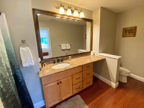 a bathroom with a sink and a mirror at FV23 Awesome on golf course in Bretton Woods with Mountain Views in Carroll