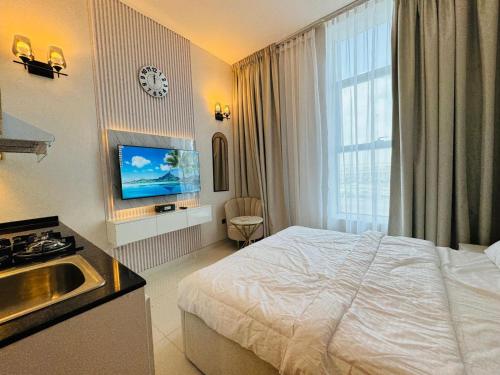 a hotel room with a bed and a sink at Al Manara Premium Deluxe Sheikh Zayed View Studio in Dubai